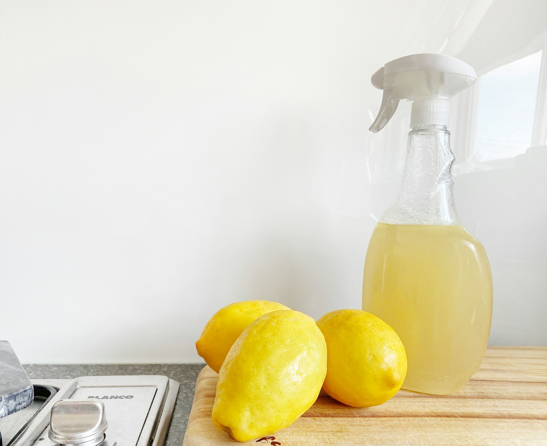 Cleaning supplies and lemons on a counter